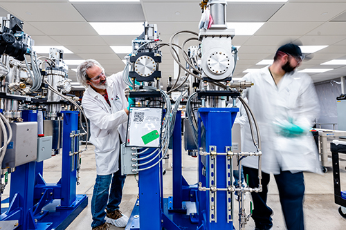 Inside the clean room in the APS Upgrade’s offsite facility, workers test the new front end assemblies, making sure they are free of dust and other particles. New front end tables will be built for every insertion device beamline at the APS. 