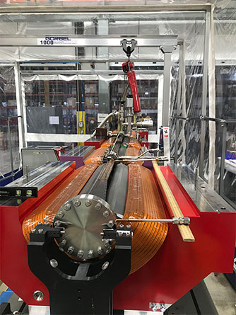 In order to install the vacuum systems, the top halves of each magnet must be removed from the partially assembled modules. The top halves alone can weigh as much as 2,500 pounds, and the vacuum system itself must be precisely installed, with roughly half a millimeter of space between the magnet and the vacuum chamber. (All photos by Jeremy Nudell, Argonne National Laboratory.)