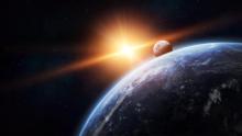 Earth in the foreground with sun and moon behind it in space.